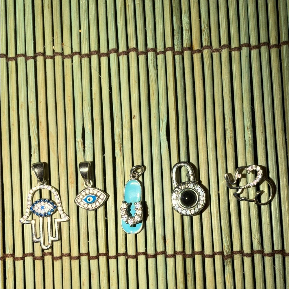 Set of 5 meaningful pedants ( no necklace attached).